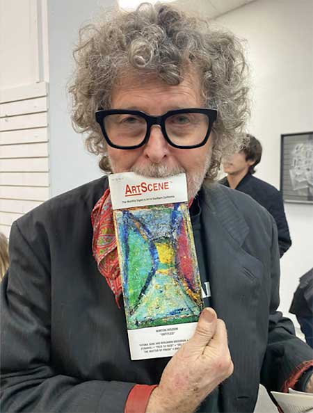 Norton Wisdom with his painting on cover of ArtScene magazine